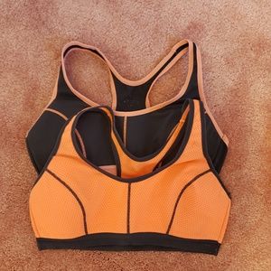 2 orange and grey sports bras